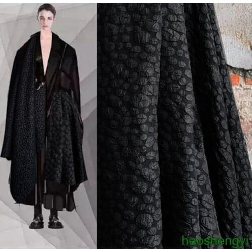 High quality black irregular oval three-dimensional texture stone flower creative fashion fabric / half price