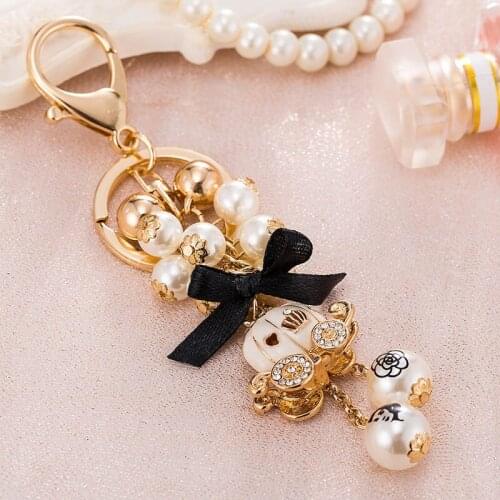 Enamel Halloween pumpkin Car Keychain Women Men Crystal Camellia Tassel Pearl Key Ring Car Wallet Accessories Z124