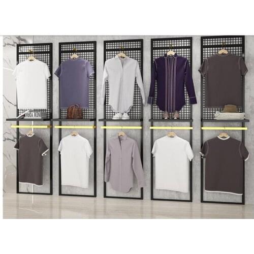 Clothing store background board display rack mens specialty store grid board shelf floor-standing hanger against the wall