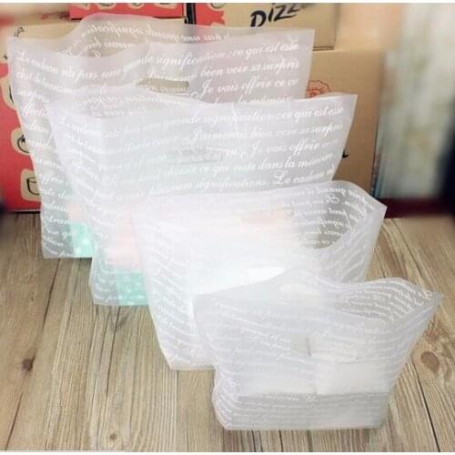 40x31cm 100pcs New Cheap alphabet Portable Handle Storage Bags Plastic Boutique Package Pouch matte clear Gift Jewelry bag