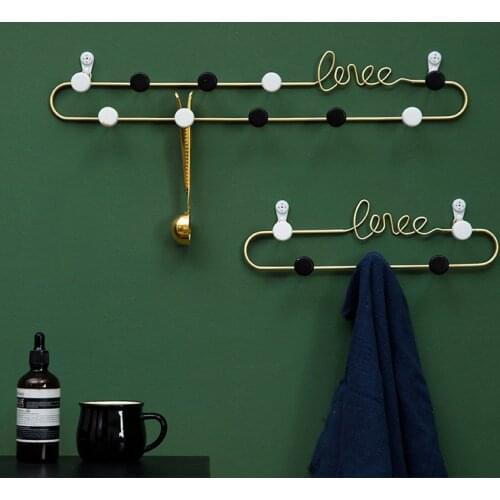 Nordic creative porch with clothes hanger on the back of the door and clothes hook on the wall hooks