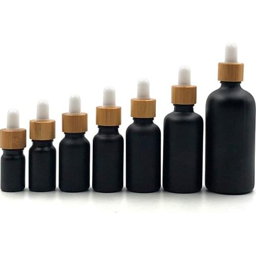 Bamboo lid vaping 5ml 10ml 15ml 20ml 30ml 50ml 100ml matte black glass essential oil bottles with bamboo protective dropper cap