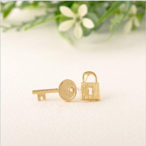 Fashion creative key and lock in combination with stud earrings