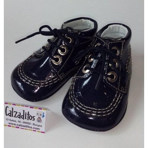 Navy blue patent leather boots with no lace-up sole