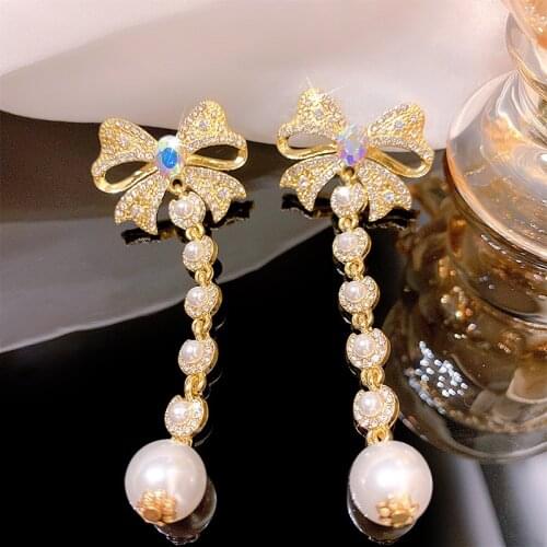 Korean version of the super fairy bow earrings womens long senior sense earrings exaggerated personality accessories