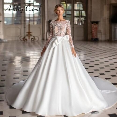 Ashley Carol Princess Wedding Dress 2021 Graceful Satin Bow Bridal Illusion Long Sleeve Scoop Beading Lace A-Line Bride Gown