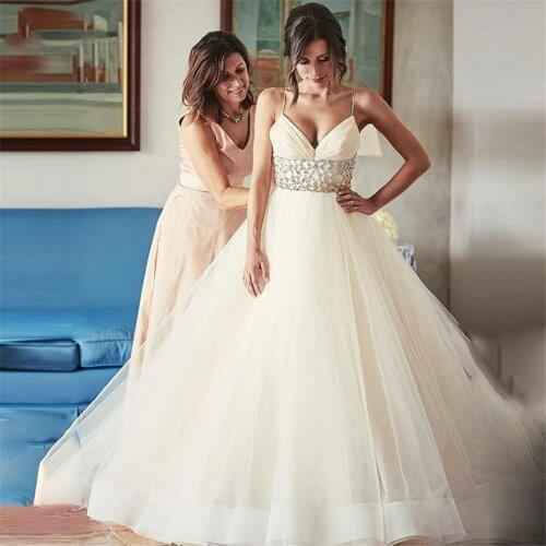 2020 Sexy Spaghetti Strips A-Line Wedding Dresses Empire Waist Crystal Beaded Backless Bridal Gowns Sexy