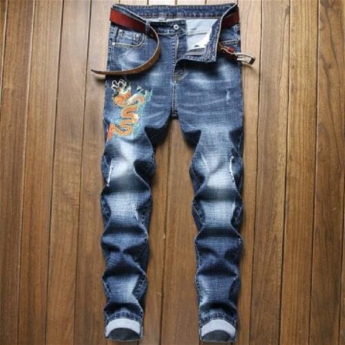 Mans jeans new European and American trend slim small straight tube fashion retro blue individual character embroidered jeans