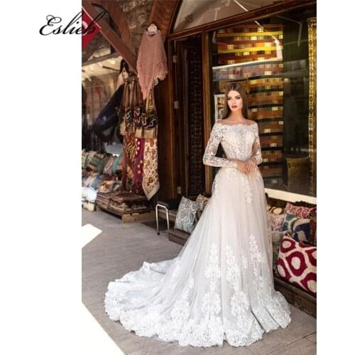 Stunning boat neck wedding dress princess style long sleeves appliques tulle skirt lace covered button back bridal gown
