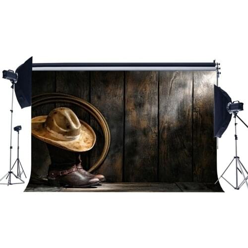 West Cowboy Backdrop Vintage Boots Straw Hat Rope on Grunge Vintage Stripes Wood Plank Rustic Wooden Floor Background
