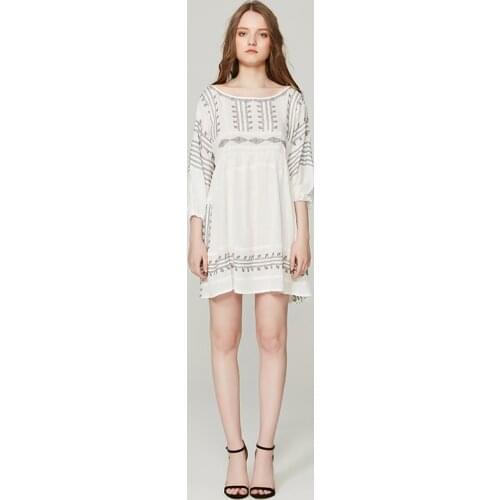 A new summer Bohemian beach resort dress with white seven-sleeve embroidered flower loose mini dress
