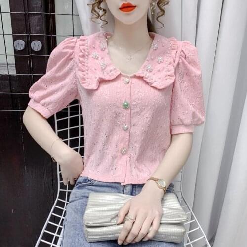 Lace shirt women 2021 fashion new Korean style temperament all-match casual fungus hook flower hollow puff sleeve short top