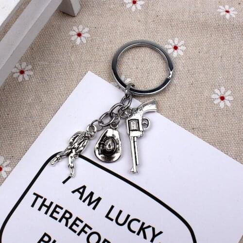 New Fashion Keychain The Walking Dead Pendants DIY Men Jewelry Car Key Chain Souvenir For Gift Revolver And Cowboy Hat Zombie