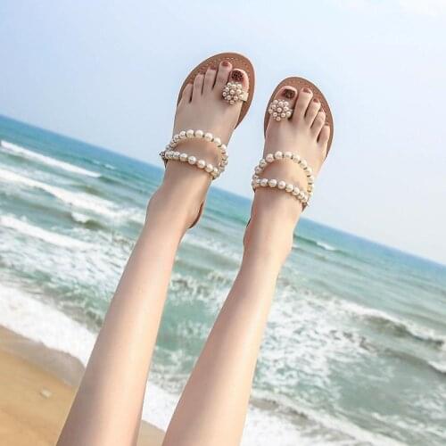 Sandals female students Korean summer flat pearl slippers wear net celebrity wild holiday beach sandals and slippers