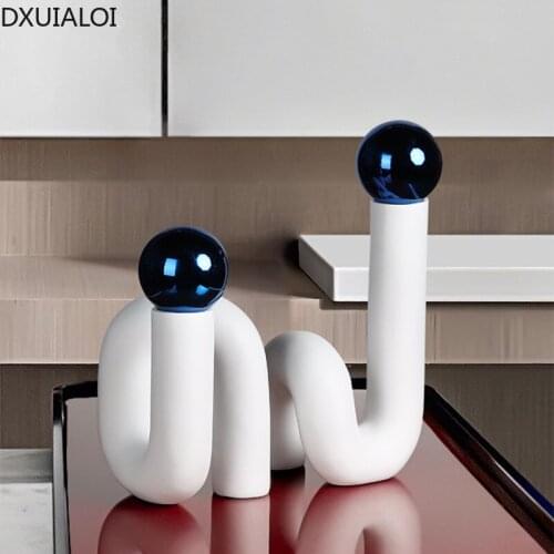 Modern simple and creative bending resin crafts metal ball decoration home decoration living room desktop study decoration