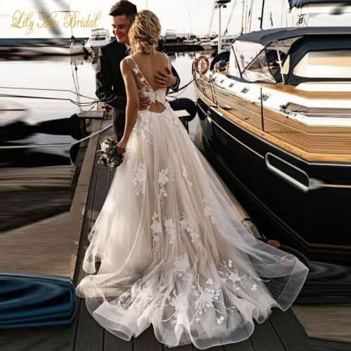 2020 Wedding Dresss Illusion Top Sheer Bateau Neck Sleeveless Lace Appliques Soft Tulle Cut Out Open Back Bridal Gowns