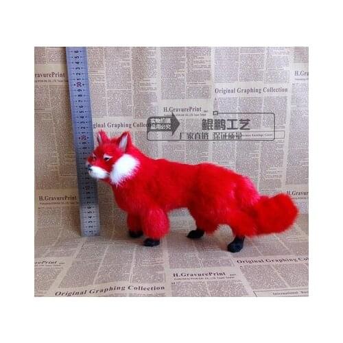 Fox stands up and poses as fairy black white Red fox spirit girlfriend presents on animal model home decoration crafts statue