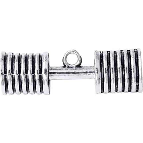 Weightlifting exercise symbol of a strong body of metal barbell charm