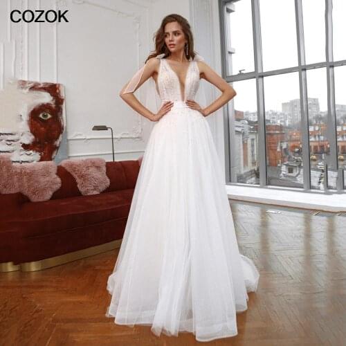 Sexy Ivory Wedding Gowns Backless Glitter Tulle Chic V Neck Adjustable Straps A Line Wedding Dresses With Peals Vestido De