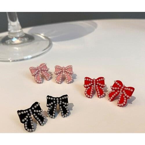 2020 new fashion trend Korean Christmas pearl bow earrings female red autumn and winter retro small fragrance earrings