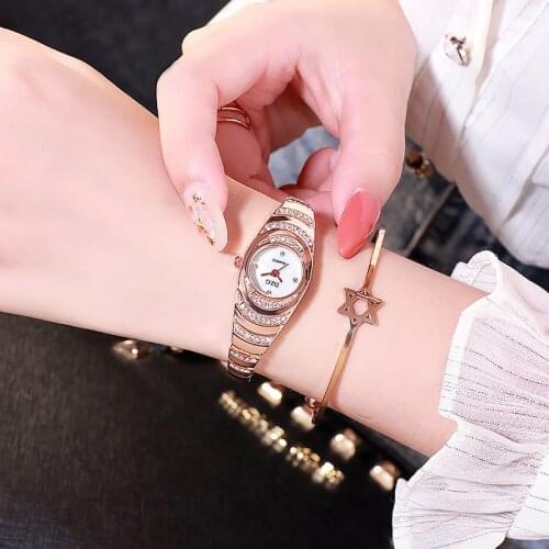 DZG new round watch female fashion diamond small and simple temperament quartz stainless steel alloy bracelet female watch