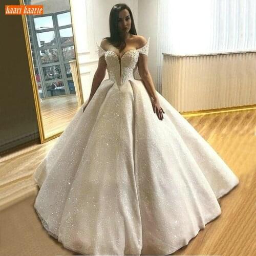 Luxury White Wedding Gowns 2020 Off Shoulder Pearls Lace Up Bling Bling Bridal Dress Long Sequined Customized Wedding Dresses