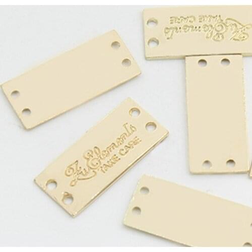 500pcs Custom 2 holes Embossed Metal label for pants decorative hand sewing tags 2.3 * 1 cm