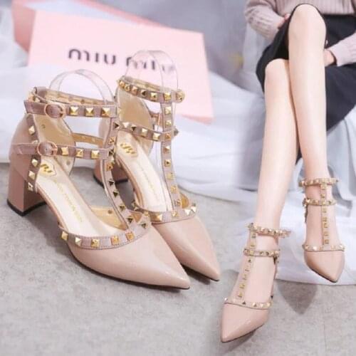 2021 spring and summer new female toe cap rivet patent leather sandals pointed toe mid-heel chunky hollow high heels