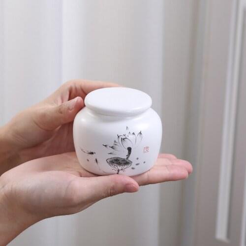 Mini ceramic tea caddy Sealed trumpet Portable Carry Travel Pu'er flower red and green tea pot Kitchen canister Tie guan yin