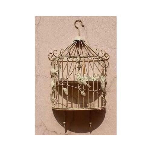 The birds in the forest Do old, wrought iron Bird cages hanging wall act the role ofing The racks hook Two color