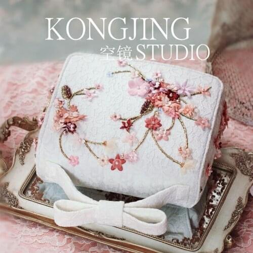 Designs a new heavy nail bead embroidered flower white pearl hand-held bow stiletto womens bag