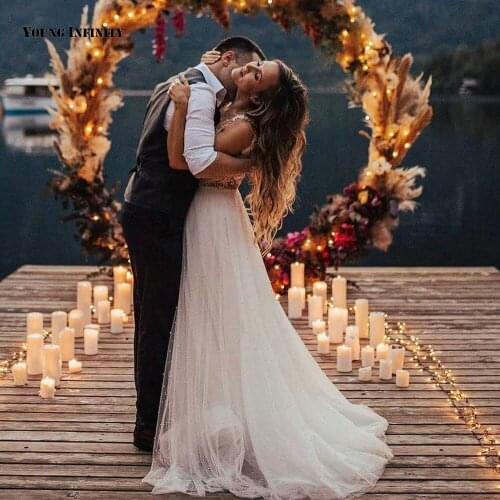 Charming Ball Gown Wedding Dresses 2021 Sleeveless Bridal Gown Illusion Back V Neck Court Train Beaded White Plus Size Bride