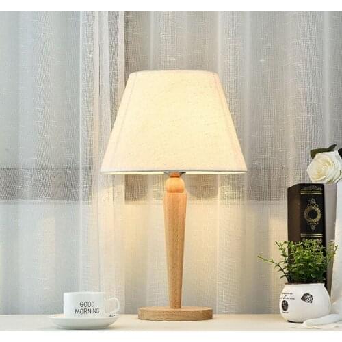 Modern minimalist bedroom bedside lamp Nordic desk cloth solid wood model room creative reading warm light wedding lighting