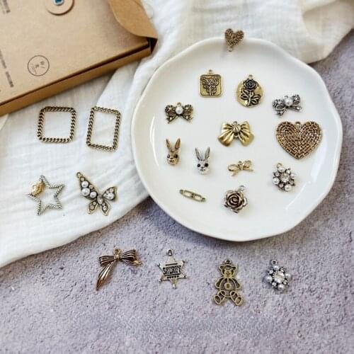 Retro and old alloy square frame flower round brand square brand point pearl bow knot DIY earrings shoe bag pendant material