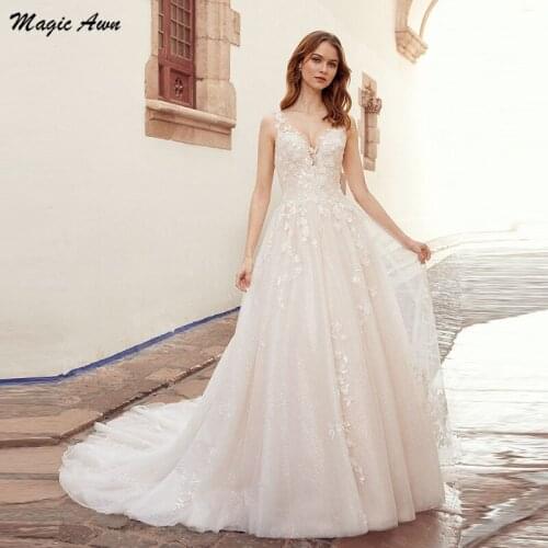 Magic Awn 2021 Beach Wedding Dresses Lace Appliques V-Neck Shiny Open Back Boho Wedding Party Dress Princess Robe De Mariage
