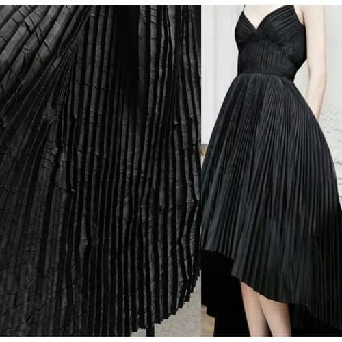 Pleated black tree pattern piano fold designer fabric