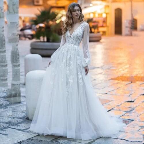 A-Line Puffy Long Sleeve Wedding Dresses 2021 V-Neck Lace Appliques Elegant Tulle Bridal Gown With Button Back Sweep Train
