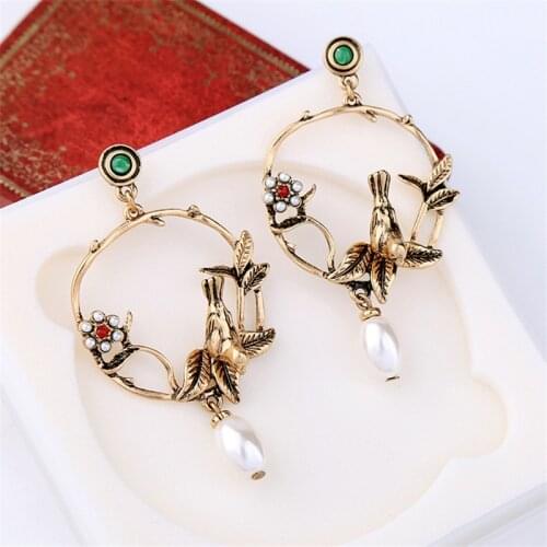 European and American temperament retro pearl stud earrings female flowers bird earrings fashion personality exaggeration