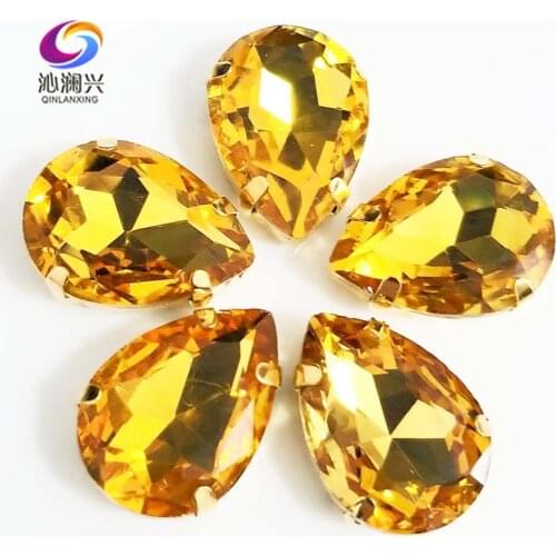 Golden bottom Golden yellow DR shape High quality AAA Glass Crystal sew on claw rhinestones,Diy/Clothing accessories SWSG19