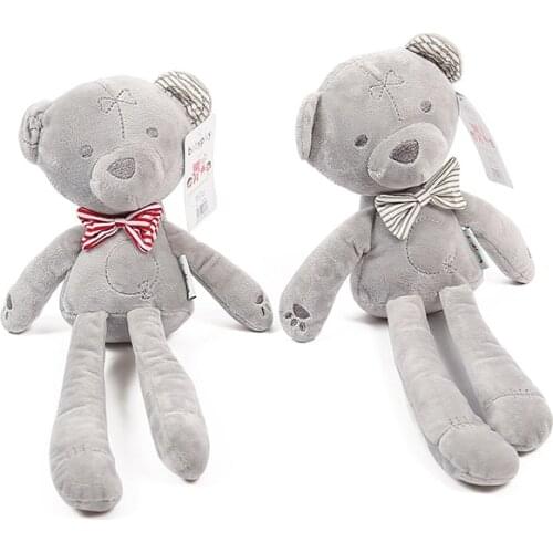 The Bear Hugs The Puppet To Comfort The Baby and Sleep with The Baby Plush Toy