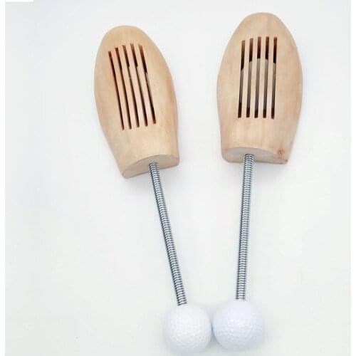 Wood material golf shoe tree with golf ba