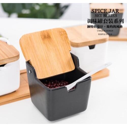 A set of ceramic spice jars, spice jars, storage containers with spoons, porcelain boxes and bamboo lids, spice jars kitchen