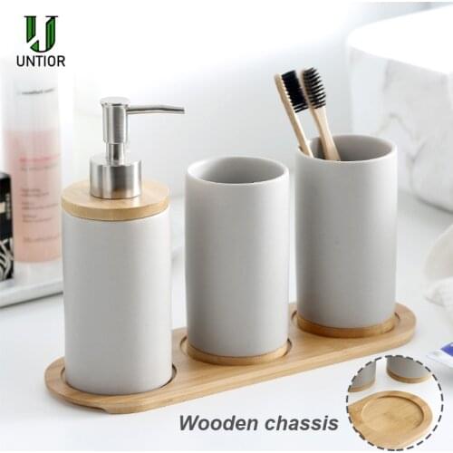 UNTIOR Ceramic Bathroom Accessories Set with Bamboo Base Include Ceramic Tumbler Soap Dispenser Toothbrush holder Bathroom Set
