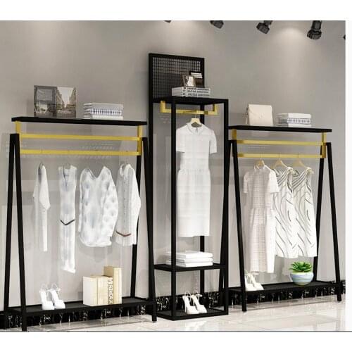Clothing store display shelf floor type shelf mens and womens clothing store display shelf black and gold combination clothes