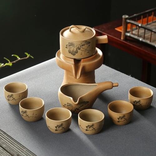 9pcs/setAutomatic tea set home creative stone grinding ceramic teapot Contains 6 tea Rotate tea set