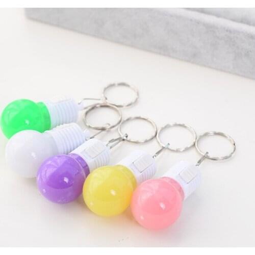 A small light bulb pendant with a key ring led a light-emitting key chain pushes small gifts