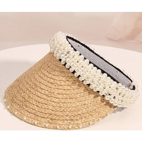 The new fashion womens are hand-stitched pear, topless , pearl brims, sun and lafite straw hats