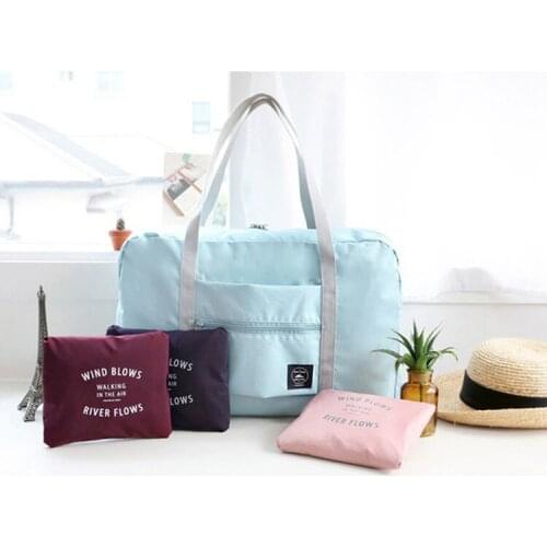 Foldable nylon portable traveling bag can be covered with trolley case airplane bag traveling luggage load reduction storage bag