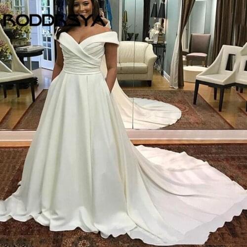 RODDRSYA Custom Off Shoulder Plus Size Wedding Dresses 2019 with Pockets Sweep Train Satin Short Sleeves Wedding Bridal Gowns