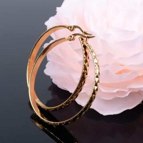 Large gold ring earrings with stripes